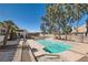 Backyard showcasing a private pool with concrete border, mature trees, and well-maintained landscaping at 3290 Vicki Ave, Las Vegas, NV 89139