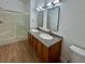 Bathroom featuring double sinks, granite counters, and walk-in shower at 3400 Cabana Dr # 1033, Las Vegas, NV 89122