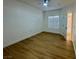 Bright bedroom with wood-look floors, a ceiling fan, and a large window at 3400 Cabana Dr # 1033, Las Vegas, NV 89122