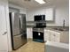 Updated kitchen featuring stainless steel appliances and ample cabinet space at 3400 Cabana Dr # 1033, Las Vegas, NV 89122