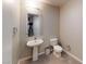 Bathroom features pedestal sink, tiled floors and a comfort height toilet at 353 E Bonneville Ave # 125, Las Vegas, NV 89101