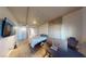 Modern bedroom featuring wood floors, concrete accent wall, and a mounted television at 353 E Bonneville Ave # 125, Las Vegas, NV 89101