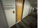 Hallway near unit #125 with access to amenities like the garage, gym and pool at 353 E Bonneville Ave # 125, Las Vegas, NV 89101