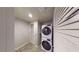Efficient laundry room featuring stacked washer and dryer for space saving at 353 E Bonneville Ave # 125, Las Vegas, NV 89101