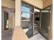 Open patio with views through the apartment, accessible through glass doors at 353 E Bonneville Ave # 125, Las Vegas, NV 89101