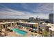 Beautiful aerial view of a sparkling community pool and cabanas, ideal for outdoor relaxation at 353 E Bonneville Ave # 125, Las Vegas, NV 89101