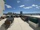 Rooftop deck area with comfortable seating, tables, and city views at 353 E Bonneville Ave # 125, Las Vegas, NV 89101