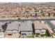 Wide aerial shot reveals a neighborhood's design with neatly arranged homes, streets, and open spaces in a sunny landscape at 356 Silva Pl, Henderson, NV 89011
