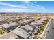 Expansive aerial view of a well-planned community showcasing rows of houses under a bright blue sky, offering a serene landscape at 356 Silva Pl, Henderson, NV 89011