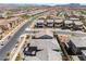 High-angle view captures a community's layout, showcasing homes with varied roof colors and neighborhood streets at 356 Silva Pl, Henderson, NV 89011