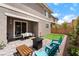 Relaxing backyard with seating area, artificial turf, and a covered patio at 356 Silva Pl, Henderson, NV 89011