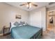 Comfortable bedroom featuring a queen-sized bed, ceiling fan, and closet at 356 Silva Pl, Henderson, NV 89011