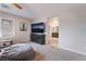 Bright bedroom with a mounted television, beanbag chair, and an ensuite bathroom at 356 Silva Pl, Henderson, NV 89011