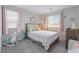 Comfortable bedroom featuring soft lighting, a patterned bedspread, and -friendly decor at 356 Silva Pl, Henderson, NV 89011
