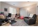 Versatile bedroom featuring a desk, sitting chair, and large window at 356 Silva Pl, Henderson, NV 89011