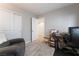 Bedroom features a comfortable chair, desk area, and closet at 356 Silva Pl, Henderson, NV 89011
