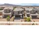 Two-story homes with two-car garages and well-kept front yards offer a welcoming neighborhood setting at 356 Silva Pl, Henderson, NV 89011