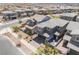 Aerial view features a well-maintained two-story home with a landscaped front yard and charming patio, in a Gathering-friendly community at 356 Silva Pl, Henderson, NV 89011