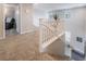 Second floor hallway overlooking the staircase with neutral walls and carpet at 356 Silva Pl, Henderson, NV 89011