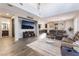 Open-concept living room with lots of natural light, wood floors, and comfortable seating at 356 Silva Pl, Henderson, NV 89011