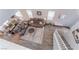 Aerial view of living room and dining area with wood floors, a sectional sofa, and a dining table at 356 Silva Pl, Henderson, NV 89011