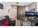 Home office with a rustic sliding door, a full desktop, and views down the hall at 356 Silva Pl, Henderson, NV 89011
