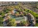A creative climbing structure amid lush trees invites exploration and play in this community park at 356 Silva Pl, Henderson, NV 89011