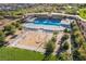 Community pool and splash pad with sunbathing chairs and covered seating provide options for everyone at 356 Silva Pl, Henderson, NV 89011