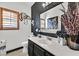 Stylish bathroom features modern decor, a white counter, and a decorative tiger art piece at 3738 Falcon Springs Dr, Las Vegas, NV 89147