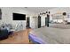 Bright bedroom with wood-look floors, walk-in closet, vanity, and a minimalist design at 3738 Falcon Springs Dr, Las Vegas, NV 89147