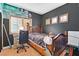 Cozy bedroom featuring wood-look flooring, a wooden bed frame, and decorative wall art at 3738 Falcon Springs Dr, Las Vegas, NV 89147