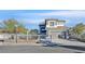 The exterior of the home features a manicured yard, a grey color scheme and a two car garage at 3738 Falcon Springs Dr, Las Vegas, NV 89147
