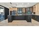 Contemporary kitchen with stainless steel appliances, sleek cabinetry, and a convenient breakfast bar at 3738 Falcon Springs Dr, Las Vegas, NV 89147