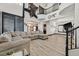 Bright living room with high ceilings, lots of natural light, and wood floors, perfect for entertaining at 3738 Falcon Springs Dr, Las Vegas, NV 89147