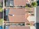 An aerial view of a home featuring a tile roof, backyard landscaping, and an attached patio at 3854 Spruceview Ct, Las Vegas, NV 89147