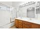 Bathroom featuring a double sink vanity and a shower over tub combination at 3854 Spruceview Ct, Las Vegas, NV 89147