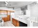 Bright kitchen with white appliances, oak cabinets, and tiled countertops at 3854 Spruceview Ct, Las Vegas, NV 89147