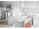 Bright kitchen featuring a tile counter, sink and warm wood-tone cabinetry at 3854 Spruceview Ct, Las Vegas, NV 89147