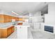 Spacious open concept featuring kitchen with tile floors and a fireplace beyond at 3854 Spruceview Ct, Las Vegas, NV 89147