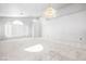 Bright and spacious living room with neutral carpet and large windows at 3854 Spruceview Ct, Las Vegas, NV 89147