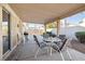 Relax on this covered patio, perfect for outdoor dining and entertaining with views of the backyard at 3854 Spruceview Ct, Las Vegas, NV 89147