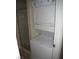 Cozy laundry area featuring a stacked washer and dryer next to shower stall at 4050 Pacific Harbors Dr # 107, Las Vegas, NV 89121