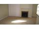Cozy living room featuring a fireplace, neutral carpeting, and a sliding glass door at 4050 Pacific Harbors Dr # 107, Las Vegas, NV 89121