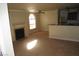 Neutral-toned living room with a fireplace, carpeted floors, and ample natural light at 4050 Pacific Harbors Dr # 107, Las Vegas, NV 89121