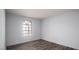 This bedroom features wood floors and a window for natural light at 4050 Pacific Harbors Dr # 245, Las Vegas, NV 89121