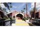 Mediterranean-style community center with arched entryway, stone accents, and manicured landscaping at 4050 Pacific Harbors Dr # 245, Las Vegas, NV 89121