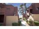 Exterior of community with a walkway, green grass and manicured landscaping at 4050 Pacific Harbors Dr # 245, Las Vegas, NV 89121