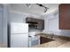 Modern kitchen with stainless steel appliances, granite countertops and track lighting at 4050 Pacific Harbors Dr # 245, Las Vegas, NV 89121