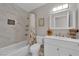 Bright bathroom features a shower-tub combo and a vanity with a sink at 4244 Totano Dr, North Las Vegas, NV 89032