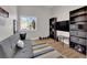 Neutral toned bedroom features a couch, desk and TV at 4244 Totano Dr, North Las Vegas, NV 89032